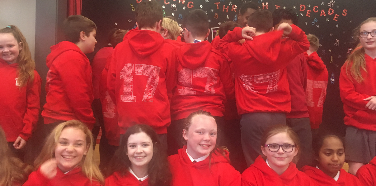 School pupils showing Koolskools Fairtrade Cotton hoodies